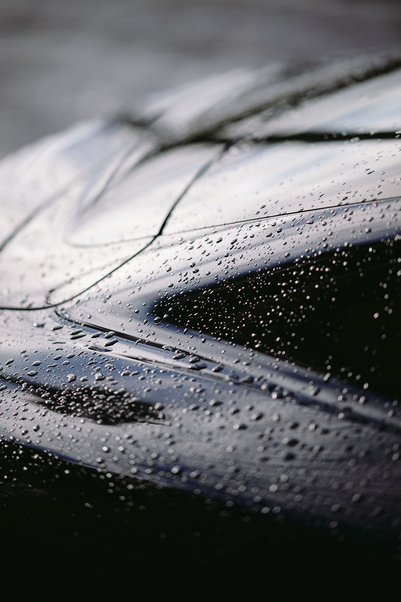 Black Porche Taycan after rain in Paco de Arcos, Portugal