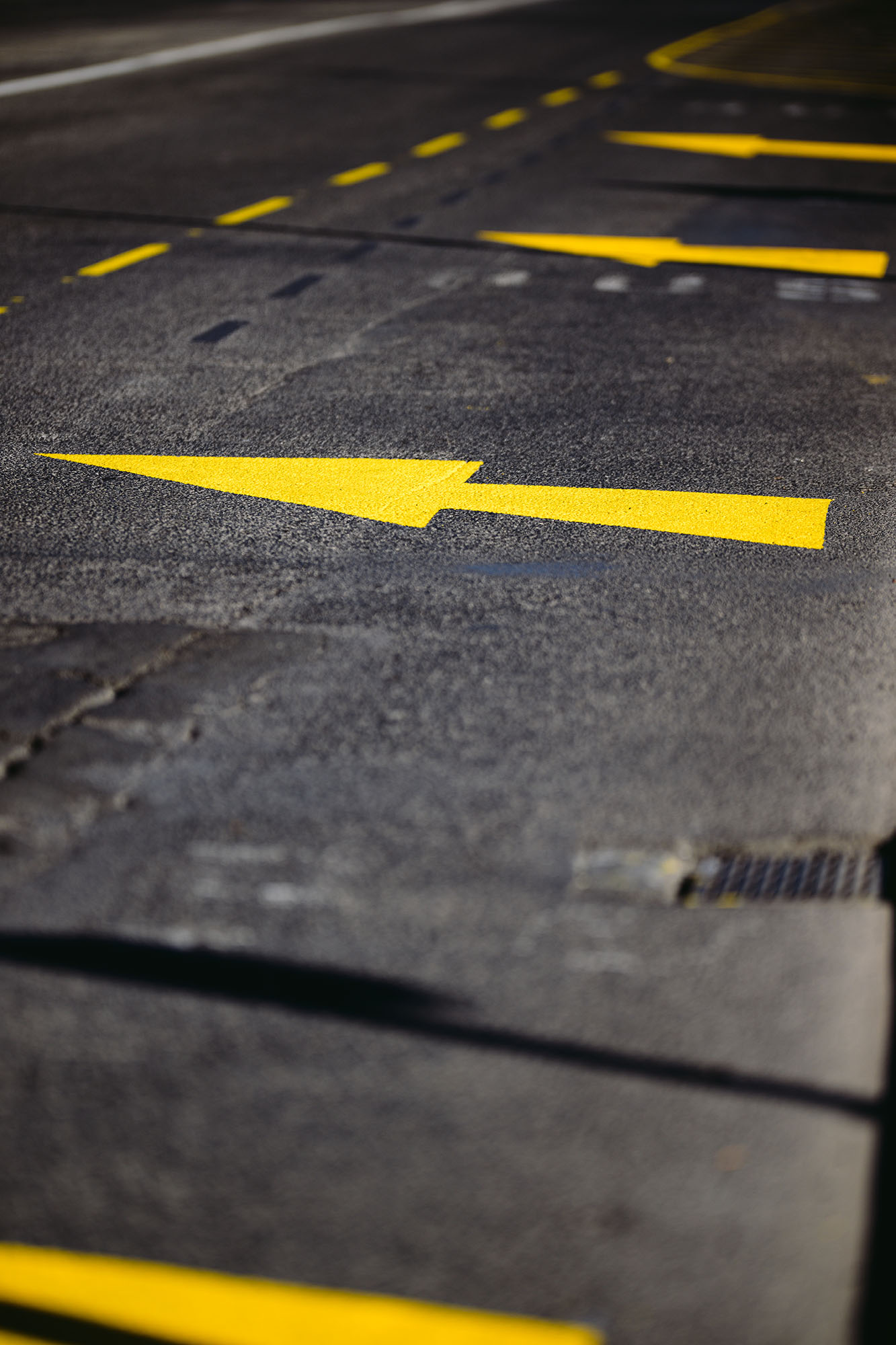 Yellow arrow road signs in Lisbon, Portugal