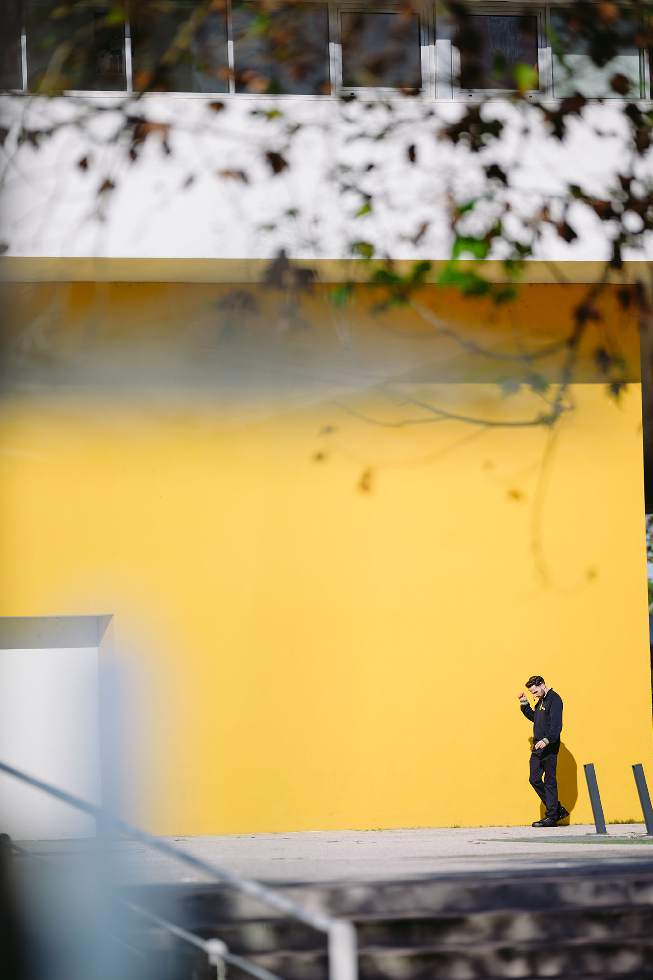 Man on a smoke break in Parque das Nacoes area of Lisbon, Portugal